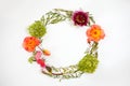 Floral round crown wreath with flowers and leaves.