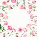 Floral round frame made of pink roses, buds and leaves on white background. Valentines day. Flat lay, Top view. Royalty Free Stock Photo