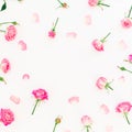 Floral round frame with pink roses buds and petals on white background. Flat lay, Top view. Roses flower texture. Royalty Free Stock Photo