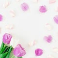 Floral round frame with pink tulips with petals and marshmallow on white background. Flat lay, Top view. Tulip flower and candy Royalty Free Stock Photo