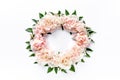 Floral round frame wreath made of pink and beige peonies flower buds, eucalyptus branches and leaves isolated on white Royalty Free Stock Photo