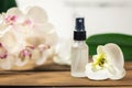 Floral scent perfume sprayer with orchid flower Royalty Free Stock Photo