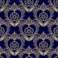 Floral seamless gold pattern on blue. Dark background with Golden decorative elements Royalty Free Stock Photo