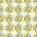 Floral seamless pattern with blue petite flowers on green background