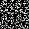 Floral seamless pattern. White swirls and foliage isolated on a black background.