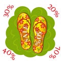 Floral summer beach flip flops on a green lawn with sales advertising