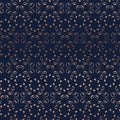 Floral symmetrical seamless pattern texture. Shiny copper gold gradient on dark blue background. Indian mandala style.