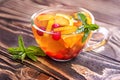 Floral tea with orange, cranberry, mint and ice