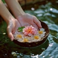 Floral touch Close up of a female hand with a submerged flower