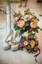 Floral wedding decoration. Wedding floristry. A bouquet of roses. White bride shoes  wedding rings Royalty Free Stock Photo