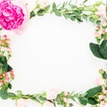 Floral wreath frame of pink peony and roses flowers, hypericum and eucalyptus branches on white background. Flat lay, top view Royalty Free Stock Photo