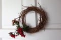 Floral wreath made up of flowers and dried twigs