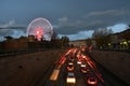 Florence, 5 December 2021. Traffic flows along the boulevards in the center of Florence with the Ferris wheel illuminated in the