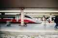 Frecciargento and senior man at Florence train station