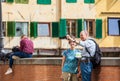 Senior tourist couple at Ponte Vecchio a medieval stone closed-spandrel segmental arch bridge over