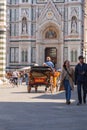 Traditional horse carts offering visitors a nostalgic city tour in Florence, Tuscany, Italy