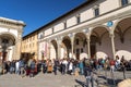 Young college graduates celebrating their graduations at the Santissima Anunziata Square in Florence, Italy