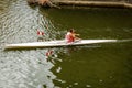 Man rower in a single scull training on the Arno River - Florence Italy