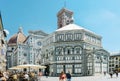 Florence, Italy - August 25, 2020: Piazza Duomo, baptistery in the foreground and the cathedral in the background. On the square