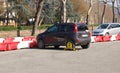FlorenceÃ¢â¬Å½, Italy, Car wheel blocked by wheel lock tool on illegal parking violation Royalty Free Stock Photo