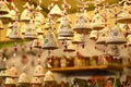 Florence, ITALY - DECEMBER 2018: small decorated bells hanging from the roof at the Christmas market
