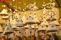 Florence, ITALY - DECEMBER 2018: small decorated bells hanging from the roof at the Christmas market