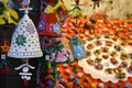 Florence, ITALY - DECEMBER 2018: small decorated bells hanging from the roof at the Christmas market