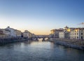 FLORENCE, ITALY, January 6, 2020: The River Arno in winter sunshine. Ponte Vechio, the famous Old Bridge, in the `blue