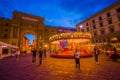 FLORENCE, ITALY - JUNE 12, 2015: Carousel at night iluminated in the middle of the square in Florence. Different forms