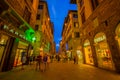 FLORENCE, ITALY - JUNE 12, 2015: Florence at night. Shops open late on summer, people visiting historical center, nice