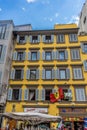 Florence, Italy - 25 June 2018: Scuderia Ferrari Scarlet Tifosi flag flying against a window in Florence, Italy Royalty Free Stock Photo