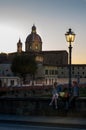 Florence, Italy - October 11, 2017: In the evening on the Ponte Alla Carraia bridge over the river of Arno in Florence