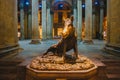 Florence, Italy - A replica of Fontana del Porcellino surrounded by marble columns and illuminated in the evening by incandescent