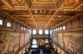 Golden ceiling and paintings on wall inside 14th century Palazzo Vecchio Royalty Free Stock Photo