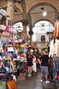 Florence, Italy. September 2023. Souvenir stalls with colorful handbags in Florence.