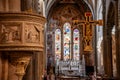 FLORENCE, ITALY - SEPTEMBER 21, 2023 - Colorful frescoes and the pulpit in the presbytery of basilica Santa Maria Novella in