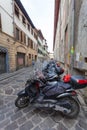 Florence, ITALY- September 11, 2016: A lot of scooters and mopeds of local citizens are parked in the narrow street in Florence Royalty Free Stock Photo