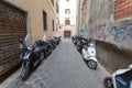 Florence, ITALY- September 11, 2016: A lot of scooters and mopeds of local citizens are parked in the narrow street in Florence Royalty Free Stock Photo