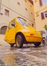 Parked electric car Pasqali in narrow street in Florence Italy Royalty Free Stock Photo