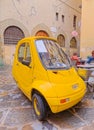 Parked electric car Pasqali in narrow street in Florence Italy Royalty Free Stock Photo