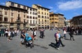 Tourists walk on the Piazza Signoria