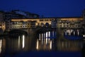 Famous bridge Ponte Vecchio with reflection in river Arno at night in Florence, Italy Royalty Free Stock Photo