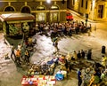 Florence at night with people enjoying themselves at a local coffee shop