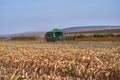 Floresti, Moldova. September 11, 2019: Green Harvesting working on a sorghum filed. Harvest season in raion of Floresti
