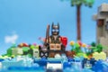 Florianopolis, Brazil. September 20, 2020: Batman minifigure fishing catwoman in lake. Concept of fishing love. Super heroes love Royalty Free Stock Photo