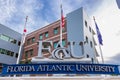 Florida Atlantic University, Davie campus entrance sign with flags - Davie, Florida, USA Royalty Free Stock Photo