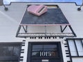 Florida Ave vintage sign on a building with a pink piano close up