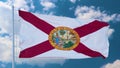 Florida flag on a flagpole waving in the wind in the sky. State of Florida in The United States of America. 3d illustration Royalty Free Stock Photo