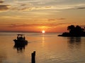 Florida gulf coast sunset boat fishing pier Royalty Free Stock Photo