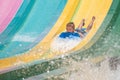 Person enjoying colorful Tamauta Racer attraction at Aquatica 2